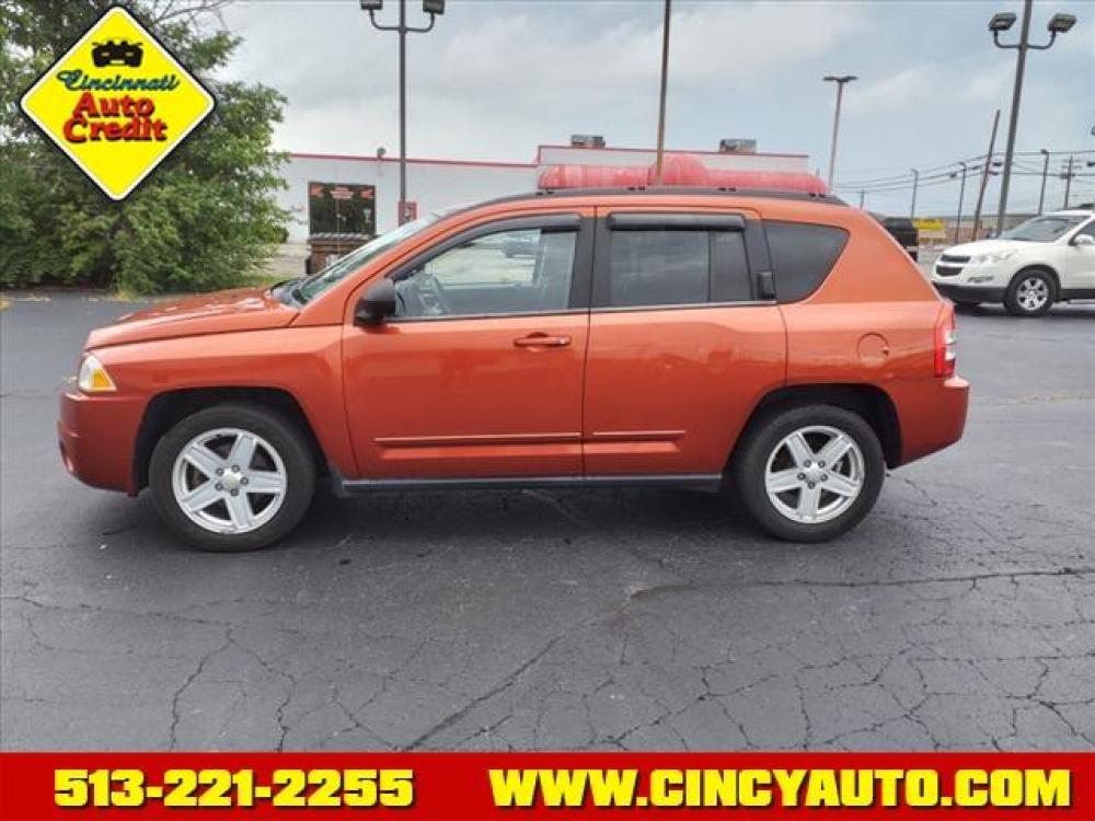 2010 Sunburst Orange Pearl Coat Jeep Compass Sport (1J4NF4FB3AD) with an 2.4L 2.4L I4 172hp 165ft. lbs. Sequential Multiport Fuel Injection engine, Other transmission, located at 5489 Dixie Highway, Fairfield, OH, 45014, (513) 221-2255, 39.333084, -84.523834 - Photo #1