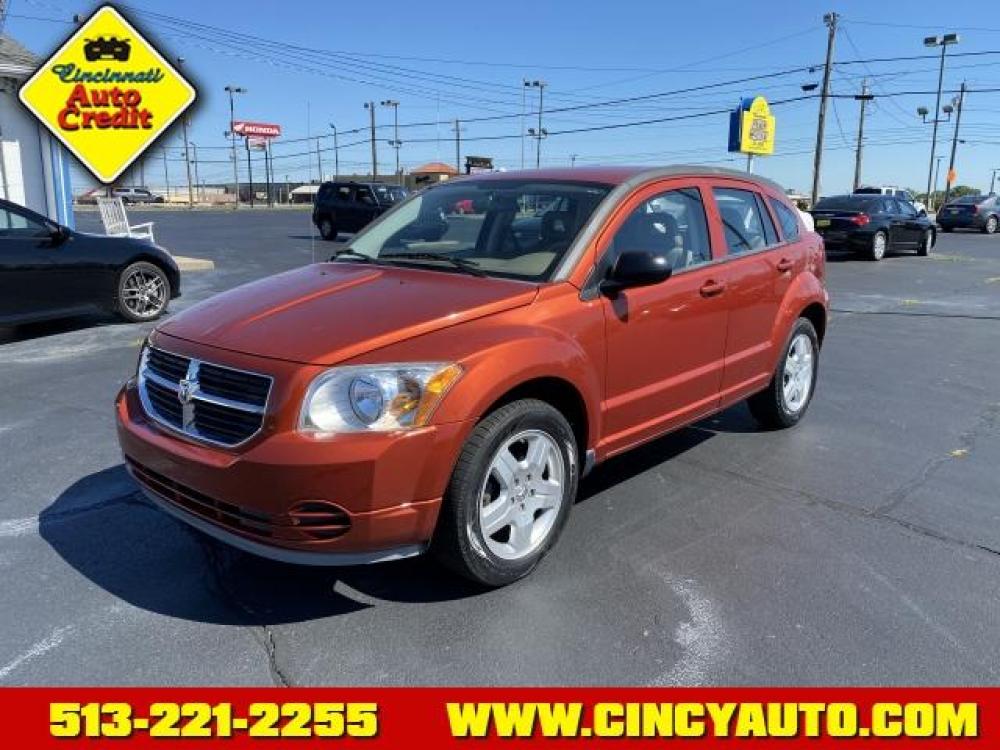 2009 Sunburst Orange Pearl Coat Dodge Caliber SXT (1B3HB48A19D) with an 2.0 4 Cylinder Sequential Multiport Fuel Injection engine, Automatic transmission, located at 5489 Dixie Highway, Fairfield, OH, 45014, (513) 221-2255, 39.333084, -84.523834 - Photo #0