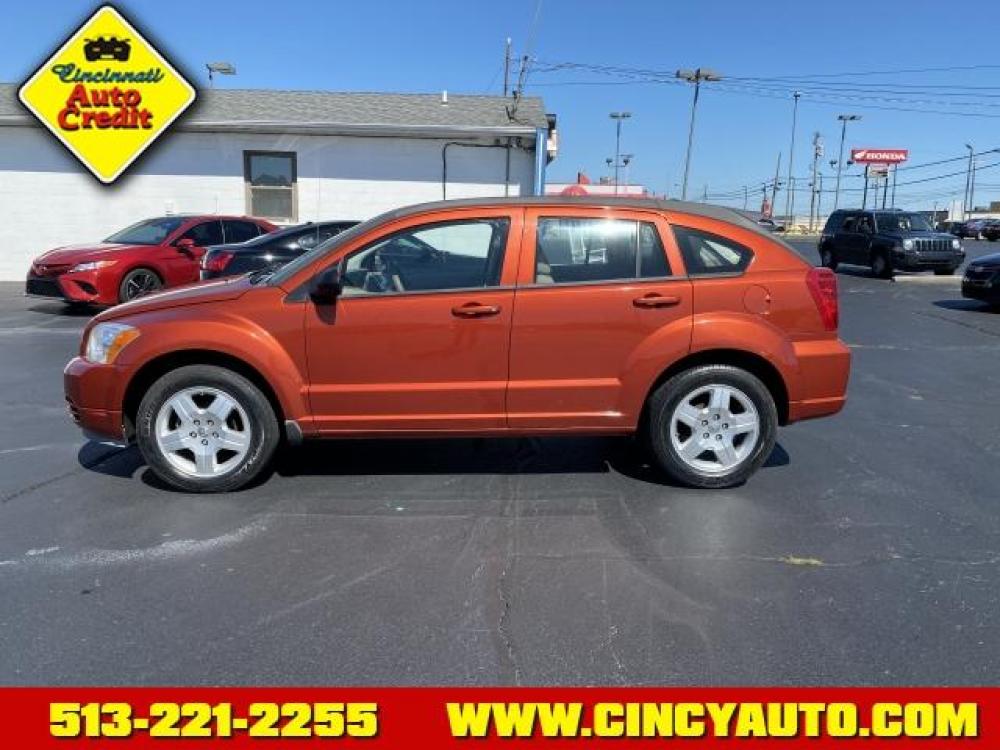 2009 Sunburst Orange Pearl Coat Dodge Caliber SXT (1B3HB48A19D) with an 2.0 4 Cylinder Sequential Multiport Fuel Injection engine, Automatic transmission, located at 5489 Dixie Highway, Fairfield, OH, 45014, (513) 221-2255, 39.333084, -84.523834 - Photo #1