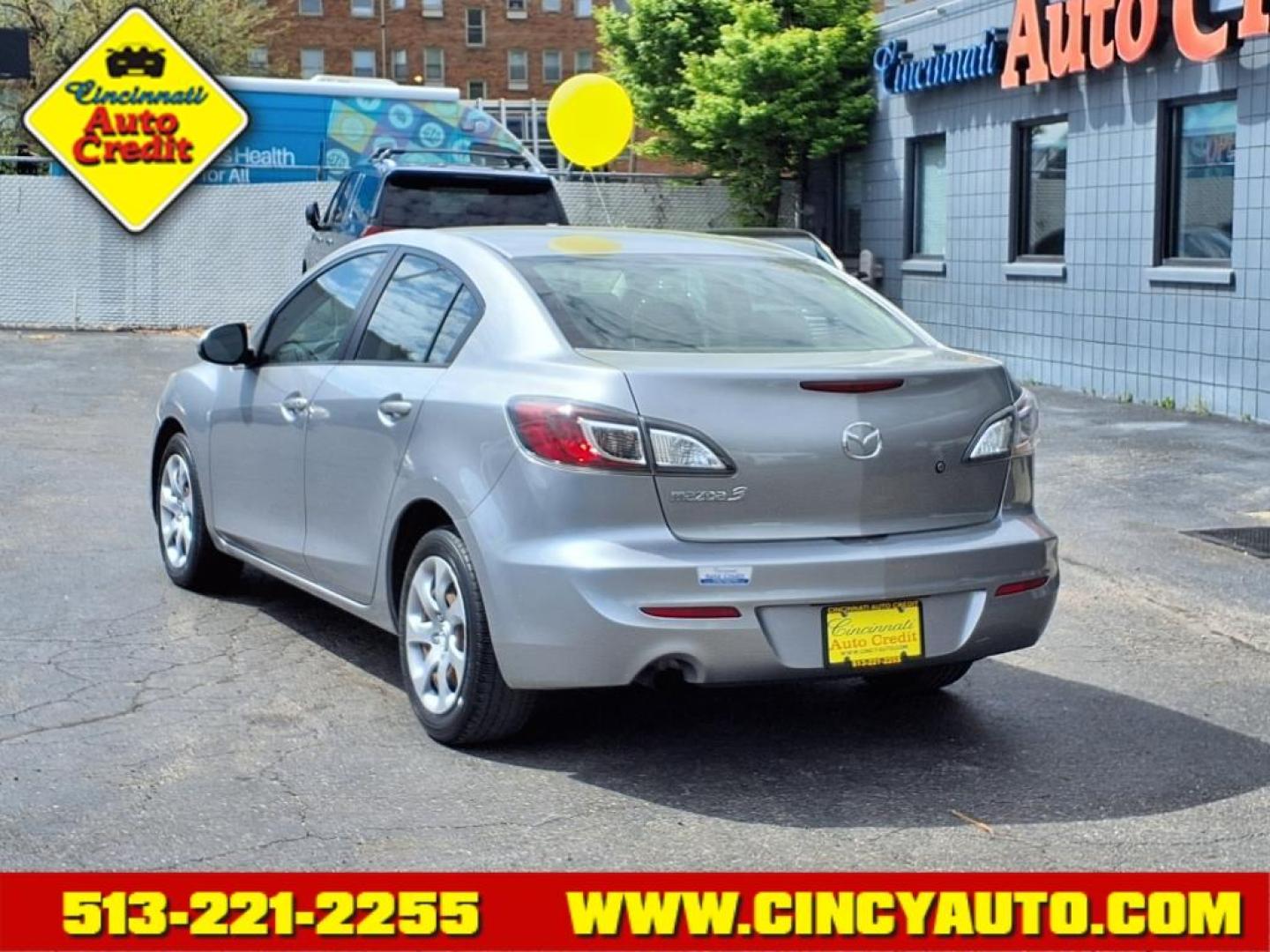 2013 Liquid Silver Metallic 38p Mazda Mazda3 i SV (JM1BL1TF4D1) with an 2.0L 2.0L I4 148hp 135ft. lbs. Fuel Injected engine, 5-Speed Automatic with Sportshift Manual 5A transmission, located at 2813 Gilbert Avenue, Cincinnati, OH, 45206, (513) 221-2255, 39.130219, -84.489189 - Photo#2