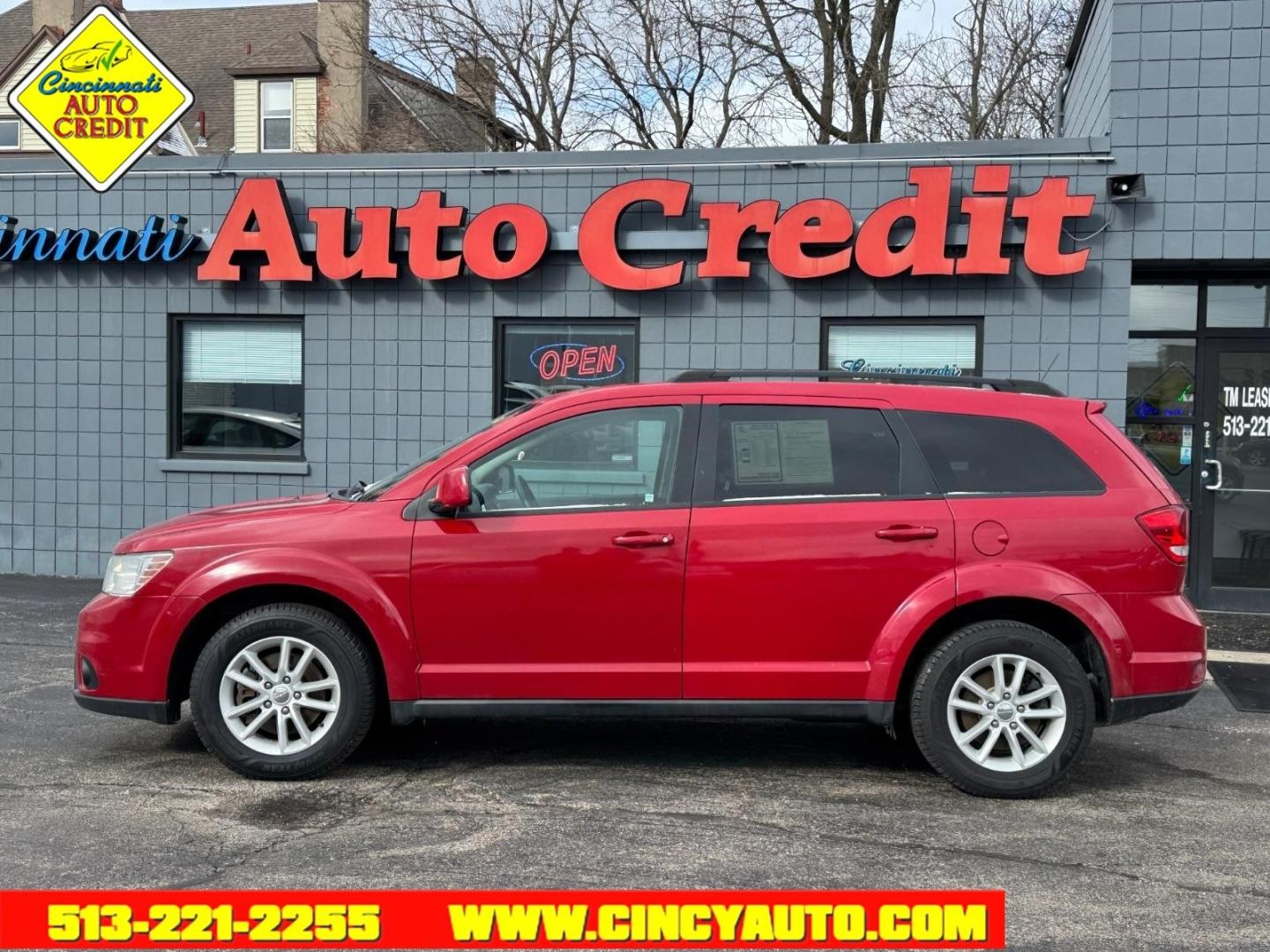2013 Bright Red Clear Coat Dodge Journey SXT (3C4PDDBG0DT) with an 3.6L Pentastar 3.6L V6 283hp 260ft. lbs. Sequential Multiport Fuel Injection engine, 6-Speed Shiftable Automatic transmission, located at 2813 Gilbert Avenue, Cincinnati, OH, 45206, (513) 221-2255, 39.130219, -84.489189 - Photo#1