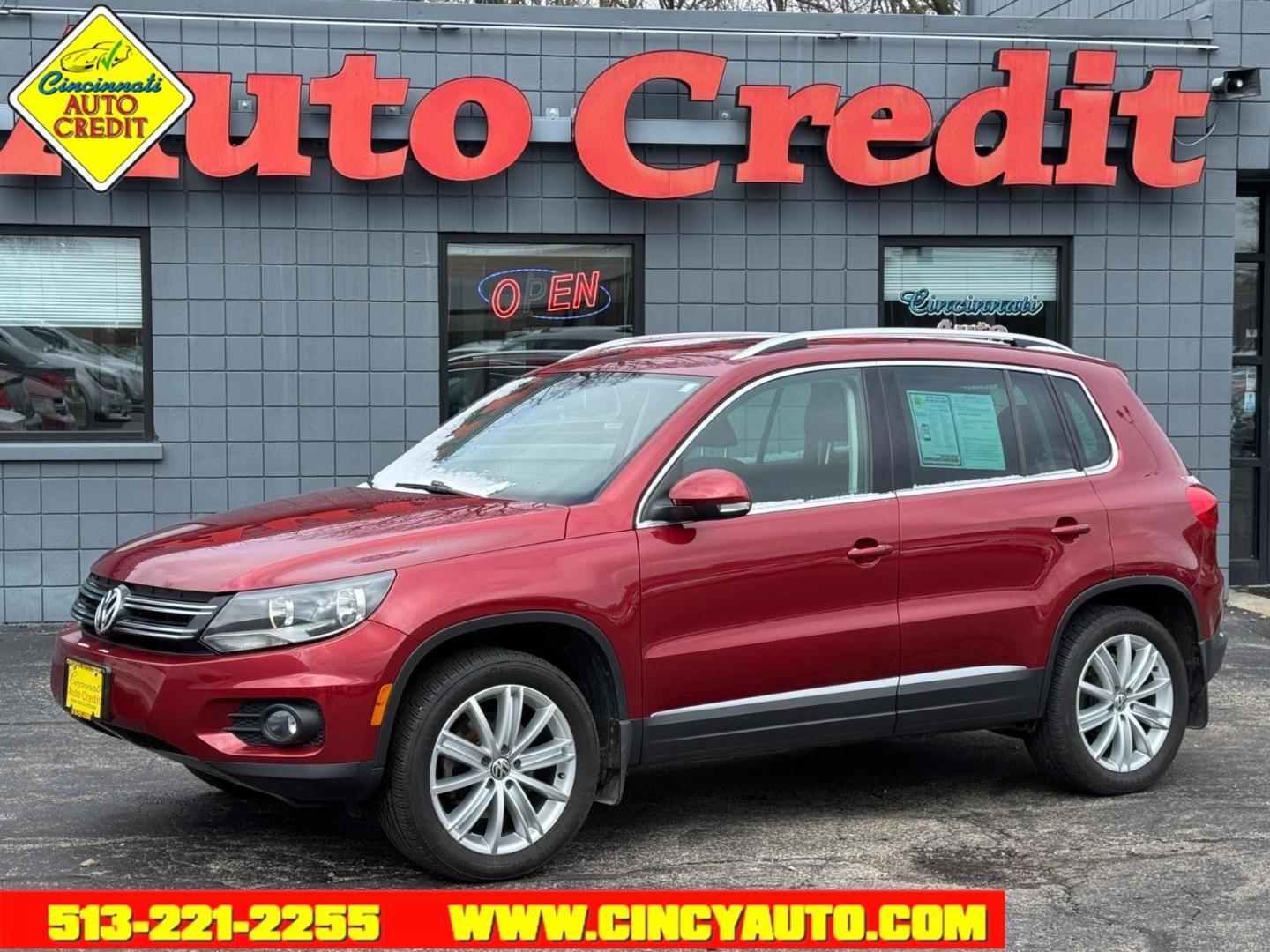 2013 Wild Cherry Metallic Volkswagen Tiguan SEL 4Motion (WVGBV3AX1DW) with an 2.0L 2.0L Turbo I4 200hp 207ft. lbs. Direct Injection engine, 6-speed Automatic with Tiptronic transmission, located at 2813 Gilbert Avenue, Cincinnati, OH, 45206, (513) 221-2255, 39.130219, -84.489189 - Photo#0