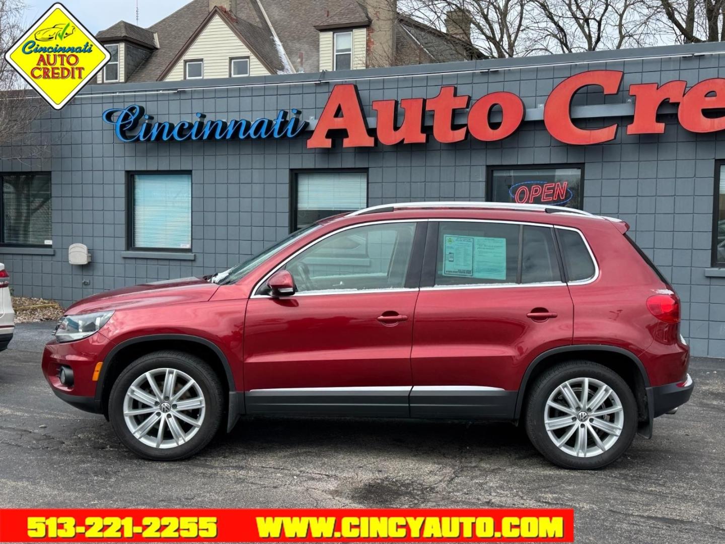 2013 Wild Cherry Metallic Volkswagen Tiguan SEL 4Motion (WVGBV3AX1DW) with an 2.0L 2.0L Turbo I4 200hp 207ft. lbs. Direct Injection engine, 6-speed Automatic with Tiptronic transmission, located at 2813 Gilbert Avenue, Cincinnati, OH, 45206, (513) 221-2255, 39.130219, -84.489189 - Photo#1