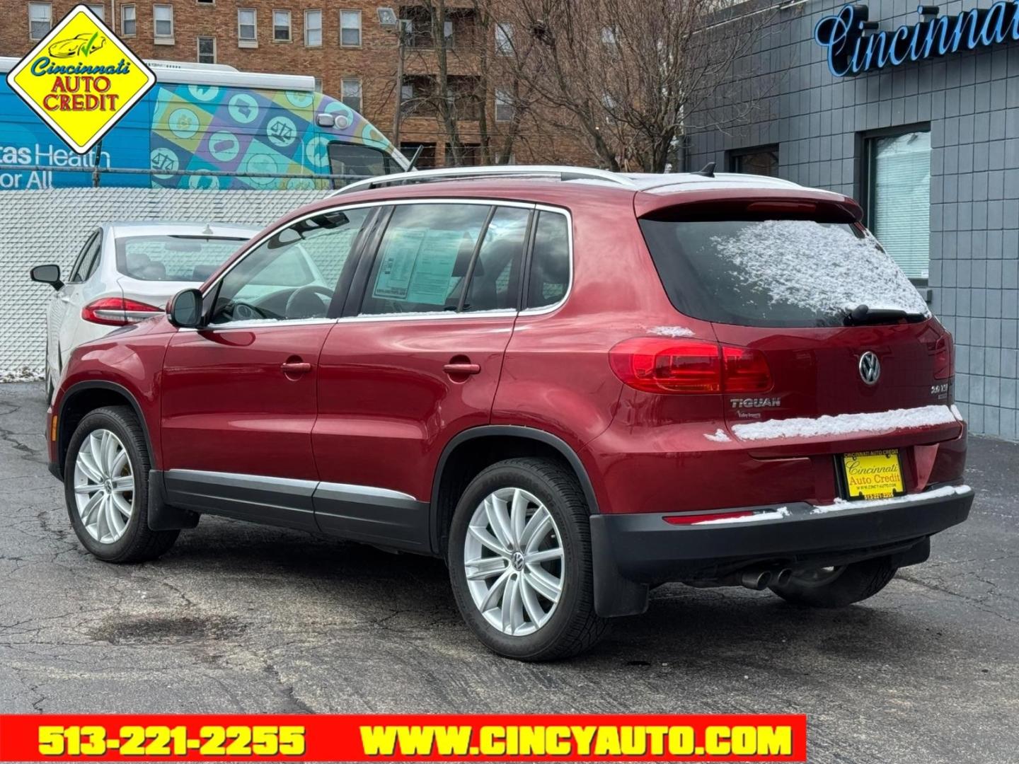 2013 Wild Cherry Metallic Volkswagen Tiguan SEL 4Motion (WVGBV3AX1DW) with an 2.0L 2.0L Turbo I4 200hp 207ft. lbs. Direct Injection engine, 6-speed Automatic with Tiptronic transmission, located at 2813 Gilbert Avenue, Cincinnati, OH, 45206, (513) 221-2255, 39.130219, -84.489189 - Photo#2